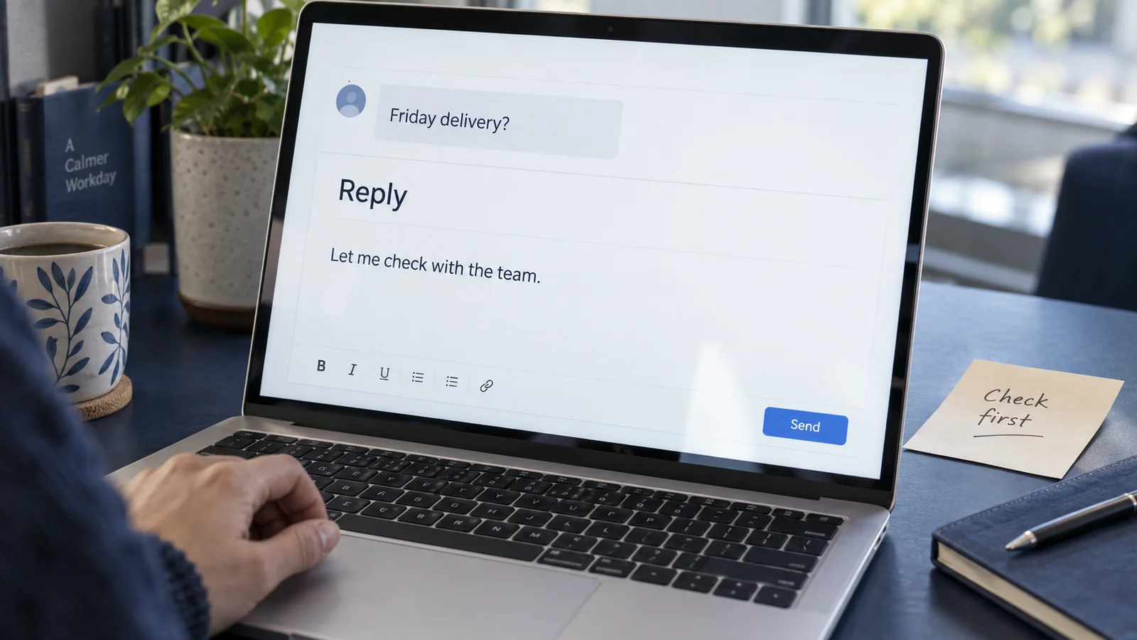 A light email draft on a navy work surface, with a small incoming message and a restrained annotation beside the proposed answer.